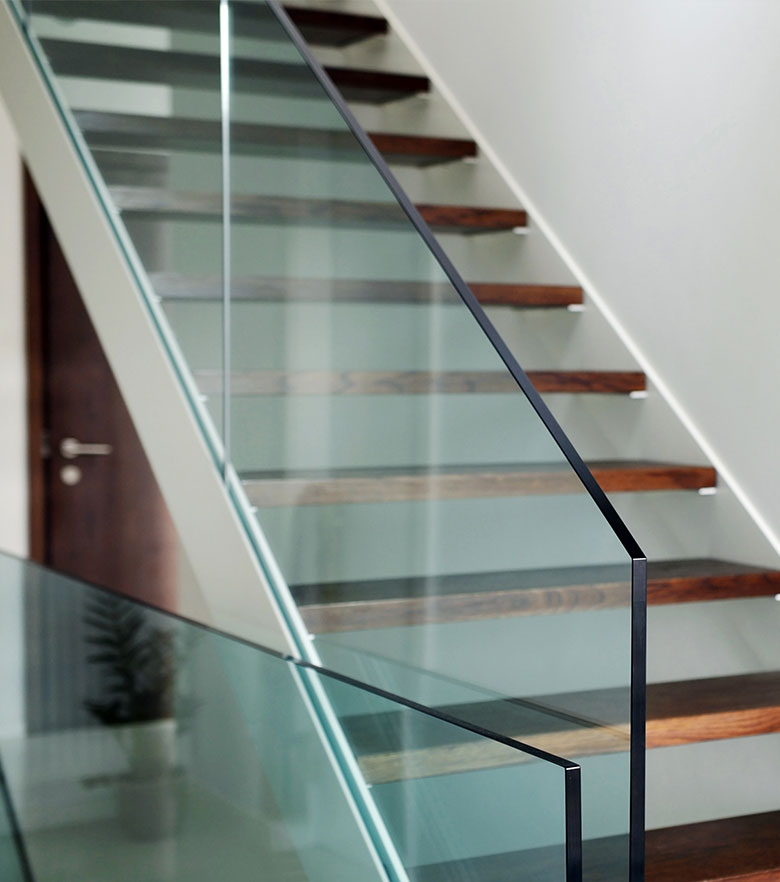 Custom residential glass installation in a modern home interior.